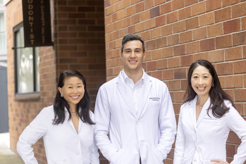 The three Bella Smile orthodontists outside the practice