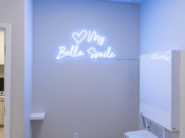 The My Bella Smile neon sign in the Hayes Valley office