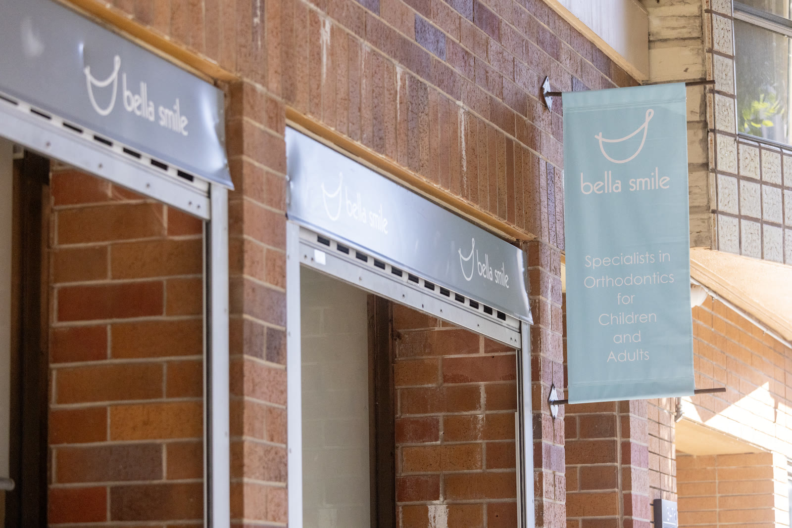 The Bella Smile storefront and sign at the Laurel Village office